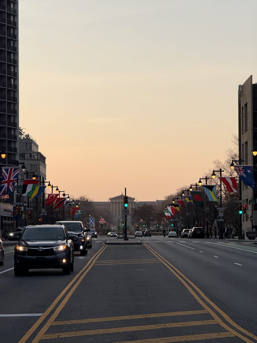 A flag-lined avenue at dusk