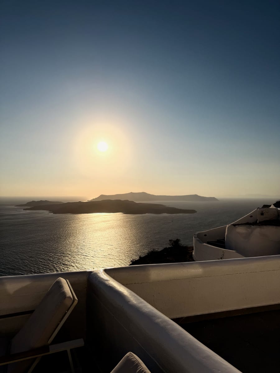 Low sun over the sea and the islands of the caldera